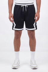 Black athletic basketball shorts with white trim and drawstring, worn by male model