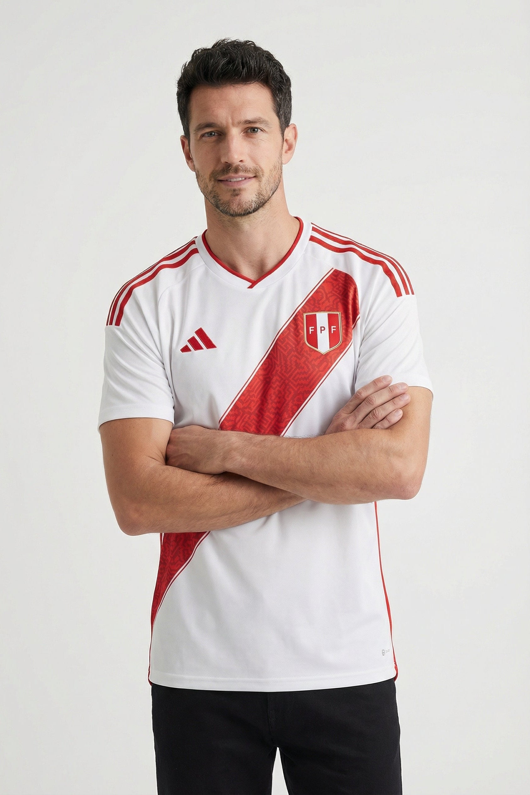 Man wearing a white and red sports jersey with Adidas logo on a white background