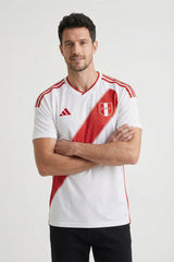 Man wearing a white and red sports jersey with Adidas logo on a white background